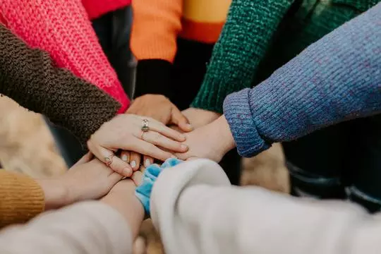 group of hands placed on top of each other