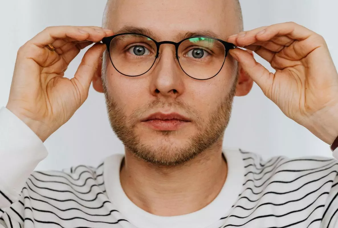 headshot of a man in stripey shirt